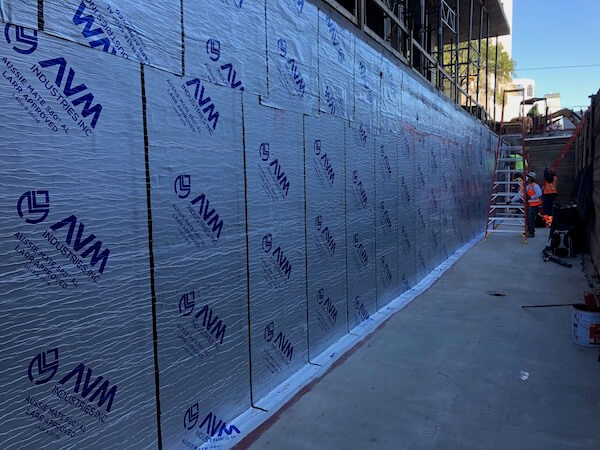 Rolls of Aussie Mate 580-AL Waterproofing being installed