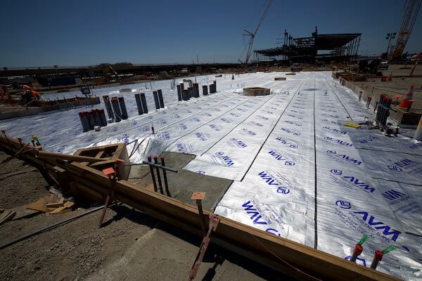 Rolls of Aussie Mate 580-AL Waterproofing being installed