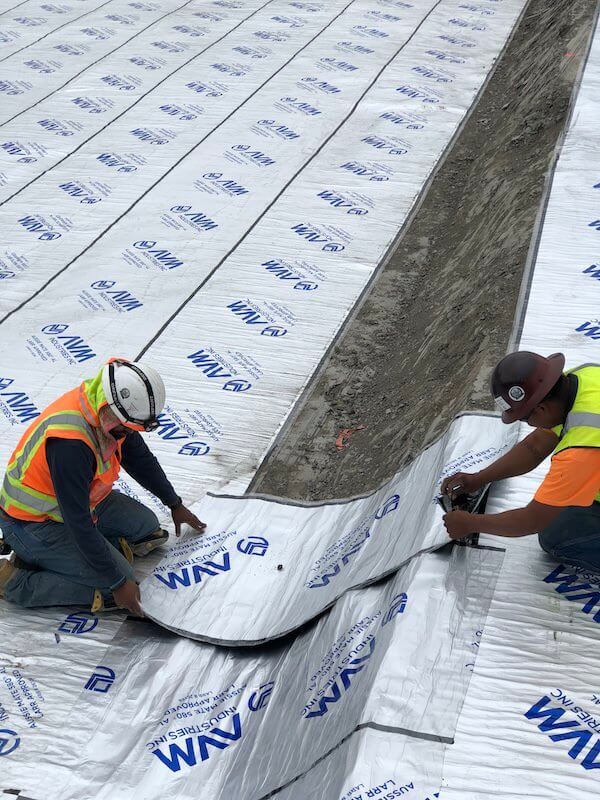 Rolls of Aussie Mate 580-AL Waterproofing being installed