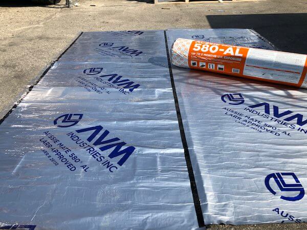 Rolls of Aussie Mate 580-AL Waterproofing being installed