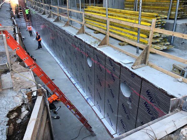 Rolls of Aussie Mate 580-AL Waterproofing being installed