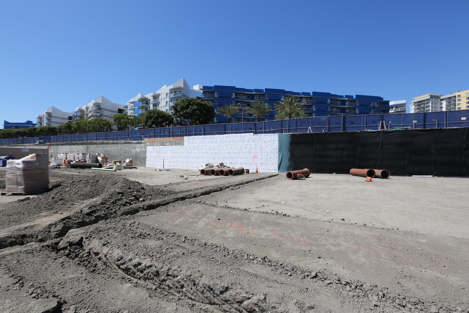 Excavated construction site prepared for below-grade waterproofing and foundation work