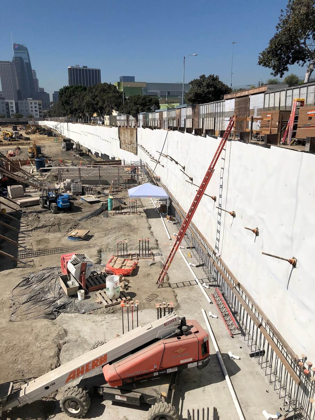 Below-grade excavation with vertical waterproofing system applied to shoring wall