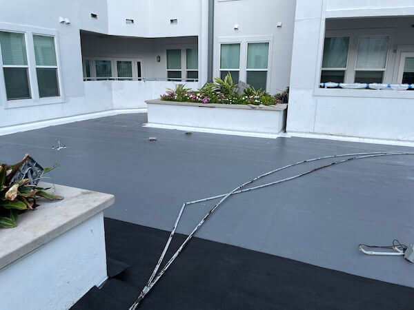 a building courtyard covered in Aussie Tite
